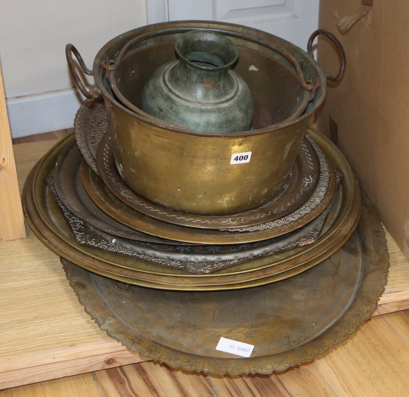 A quantity of Eastern metalware trays, etc.